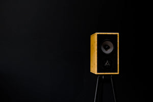 The Mikros speaker with a black background